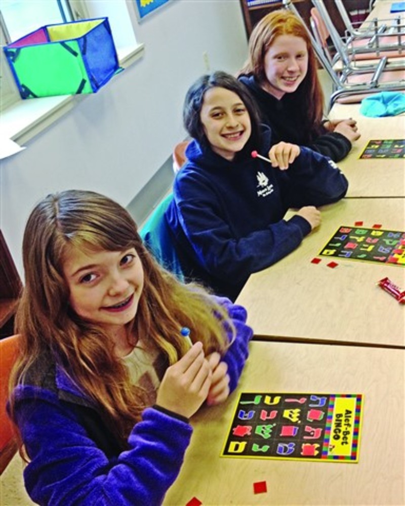 Sixth graders, Jordan Kalinsky, Jennifer Berman and Samantha Finder play Hebrew Bingo. /COURTESY | TORAT ISRAEL